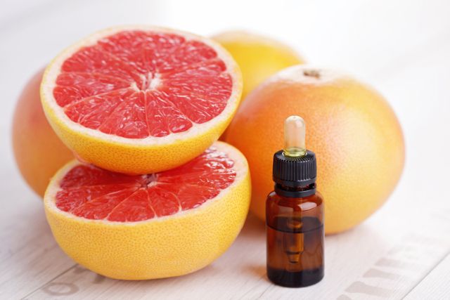 bottle of grapefruit essential oil - beauty treatment